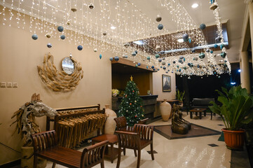 Beautiful Christmas tree decorations in an old-fashioned house with blue and silver balls hanging for family events and celebrations with loved ones