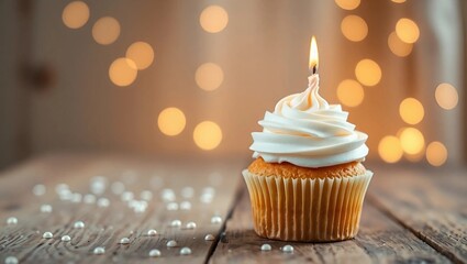 A single whimsical cupcake with fluffy buttercream frosting and a lit candle, placed on one side of a rustic wooden table, surrounded by subtle scattered confetti
