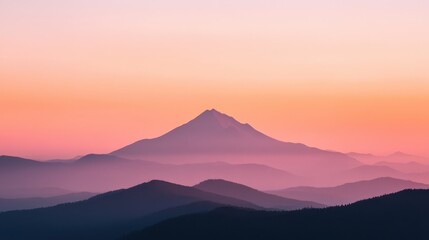 Serene silhouette of a mountain peak against a colorful sunset sky