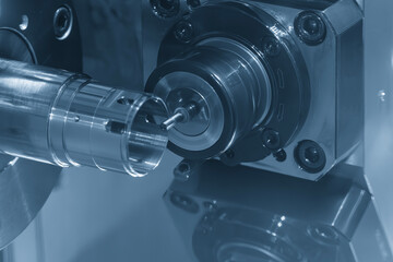 The CNC lathe machine milling the metal tube parts by milling spindle.