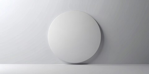 Minimalist blank circular display on a light gray wall