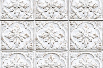 Vintage white floral patterned tin ceiling tiles with ornate design