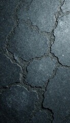 Obraz premium Rough, dark gray concrete floor with visible aggregate , shadowy, weathered