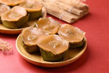 Sticky rice cake (Nian Gao), Chinese New Year cake on red background