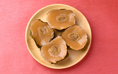 Sticky rice cake (Nian Gao), Chinese New Year cake on red background, Top view