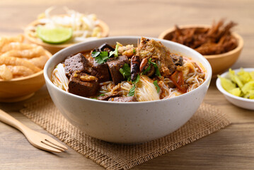 Northern Thai food, Spicy rice noodles soup with pork eating with fresh vegetables, Local Thai food