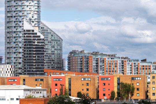 This vibrant image features a blend of colorful buildings within an urban community, emphasizing architectural diversity and the liveliness of city life in a modern context in London UK