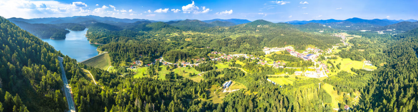 Lokvarsko lake and green nature of Gorski Kotar aerial panoramic view