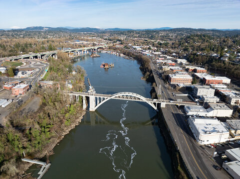 Completed in 1922, the Oregon City Bridge, also called the Arch Bridge, spans the Willamette River connecting West Linn and Oregon City, Oregon.