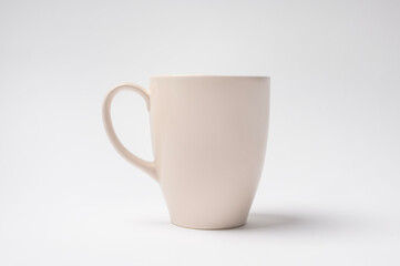 Simple White Mug Stands Upright on a Plain Background Highlighting Its Minimalist Design