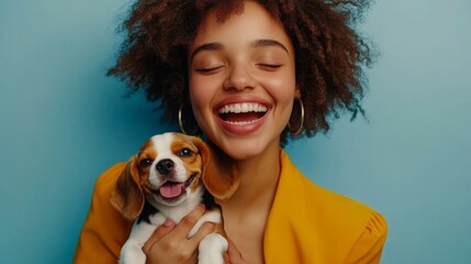 A happy young woman holding a small beagle, looking cheerful and relaxed