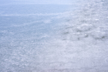 Natural texture of ice, frozen lake  as  background.