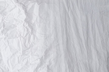 Crumpled white paper background.