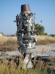 A broken airplane engine is found outside a junk shop in Thailand.