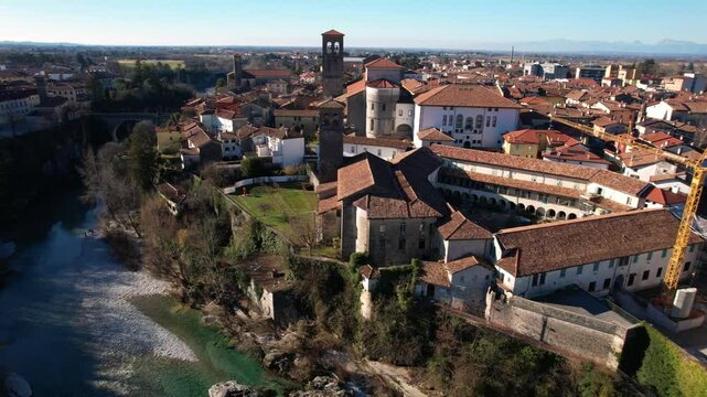 Cividale del Friuli Comprehensive Aerial View: Emerald Natisone River, Ancient Devil's Bridge and Medieval Town Panorama, UNESCO Heritage Site, Northern Italy Winter