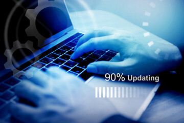 Software and system update; Hand  using computer and progress bar; System security improvement