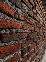 Black and red grunge brick wall texture background photo with dirty and old vintage style pattern.