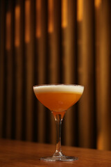 Close up of a cocktail in a glass with lavender and cream. Japanese Whisky Sour cocktail