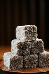 Coffee pot and Turkish delight on a black background, selective focus