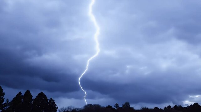 dramatic video of multiple lightning bolts flashing in a dark stormy sky illuminating thick clouds at random moments with an included matte channel
