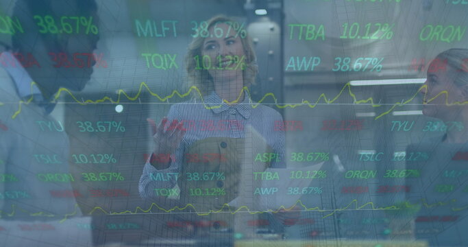 Image of financial data processing over diverse business people in office