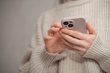 shot of woman looking at phone. Woman using technology. Technology content