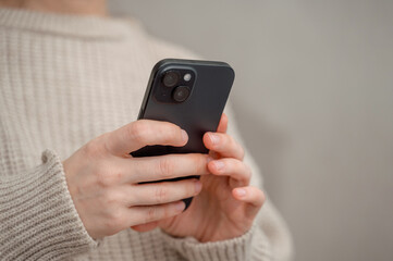 shot of woman looking at phone. Woman using technology. Technology content