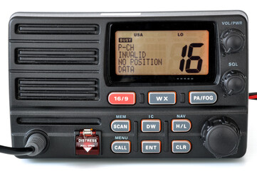 Close-up front panel of VHF Radio communication device showing distress signal and channel information