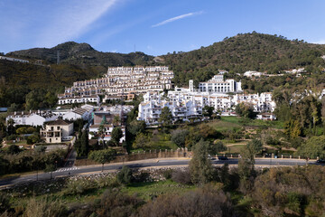 Obraz premium Aerial of mountainais Benahavis village luxury housing along the sun coast