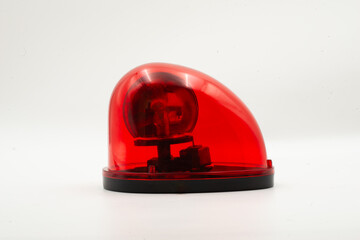 Red emergency light isolated on white background showcasing its design and function for emergency warning