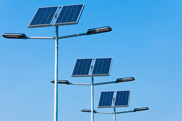 Obraz premium Solar panels installed on streetlights enhance energy efficiency in urban area