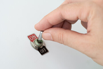 Hand turning a switch from off to on, business concept for starting project