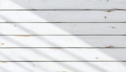 white wooden planks with natural shadow effect create a simplistic yet elegant pattern. The image evokes a sense of warmth and texture