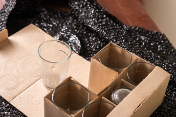 Unpacked Glassware in Cardboard Box