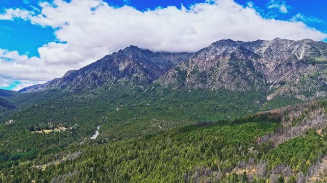 Fitzroy emerald embrace.Experience the breathtaking beauty of Patagonia. Enjoy the famous peaks of Mount FitzRoy nearby,while a sea of green forest stretches below, untouched and pristine.