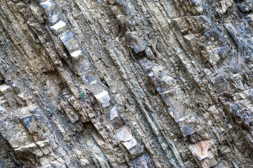 Rough texture of a grey mountain wall in Albania