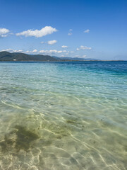  Beautiful beach with clear turquoise water on a sunny day