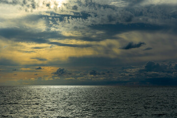 Picturesque sunset over the sea with dramatic clouds creating an unusual intriguing image. Black Sea end of summer