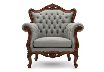 An ornate vintage armchair with a tufted gray upholstery and carved wooden frame, isolated on a white background