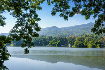 Fototapeta premium a public place leisure travel landscape lake views at Ang Kaew Chiang Mai University and Doi Suthep nature forest Mountain views spring cloudy sky background with white cloud.