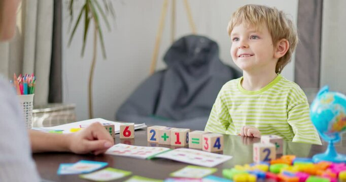 Happy child high-fiving during learning activity