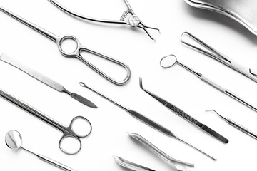 Flat lay of surgical stainless metal hand tools. Professional medical equipment and instruments