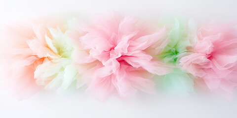Fototapeta premium A soft, ethereal composition of pastel-colored tulle arranged like delicate flowers, creating a dreamy, airy aesthetic on a white background.