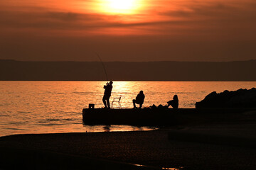 fishing at sunset