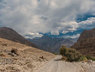 A mountain range with a road in the middle of it