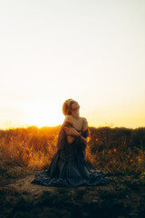Dramatic woman in field