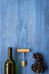 Open bottle of wine with cork and grapes. Wine background