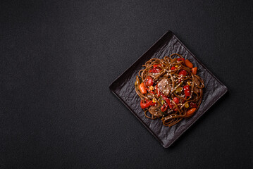 Delicious spicy Asian food soba with buckwheat noodles, beef, vegetables