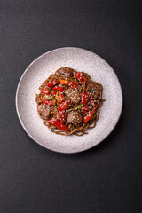 Delicious spicy Asian food soba with buckwheat noodles, beef, vegetables