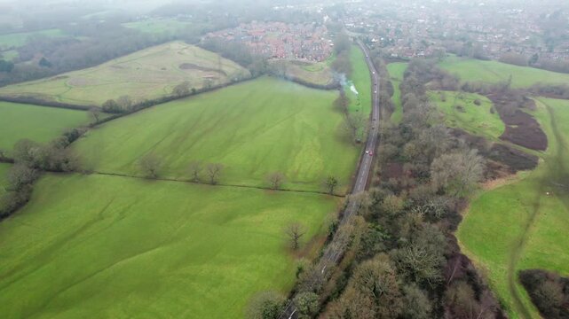 Aerial view of the Farnham Park and Dora's Green, Farnham, Surrey, England. Misty Winter day